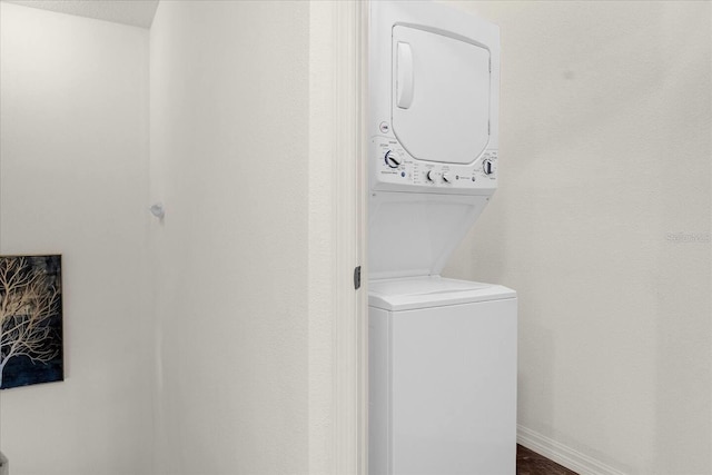 laundry area with stacked washer and clothes dryer