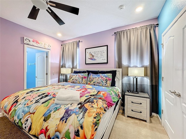 carpeted bedroom featuring ceiling fan