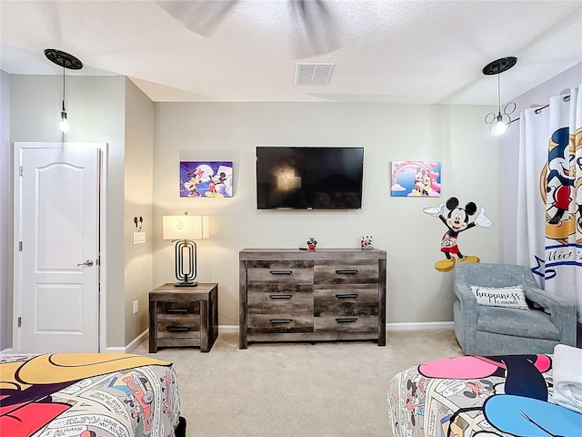 carpeted bedroom with a textured ceiling and ceiling fan