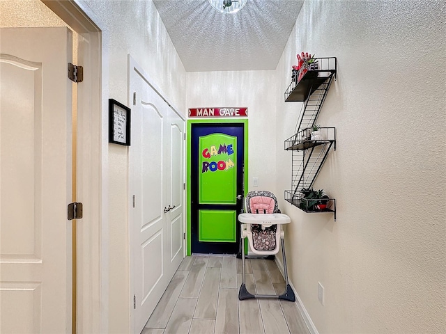 interior space with a textured ceiling