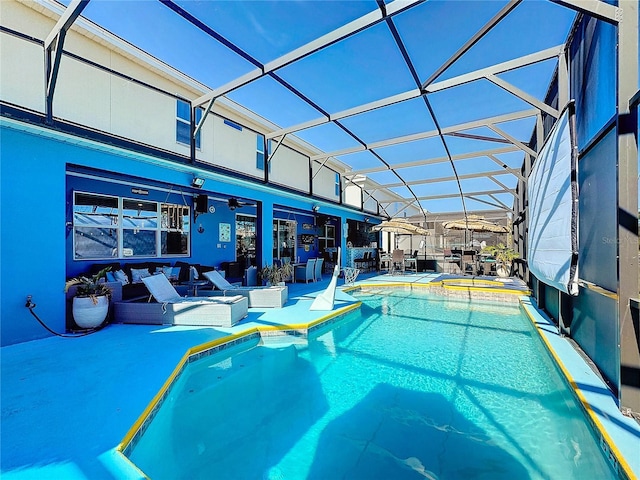 view of pool with ceiling fan, a lanai, a patio, and an in ground hot tub