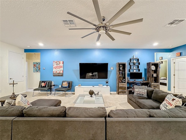 living room featuring a textured ceiling, light colored carpet, and ceiling fan