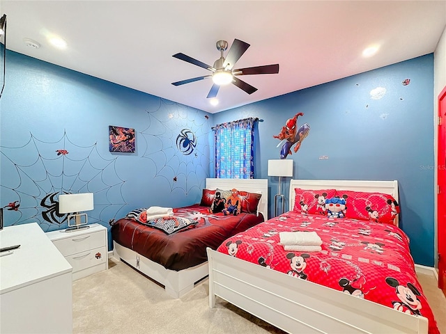 bedroom featuring ceiling fan and light colored carpet