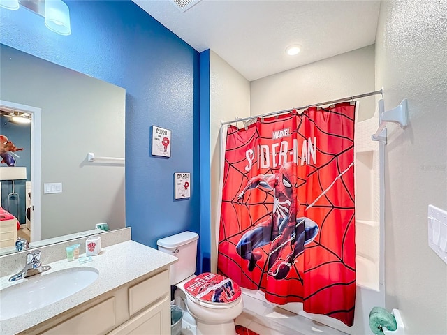 full bathroom with vanity, shower / bath combination with curtain, and toilet