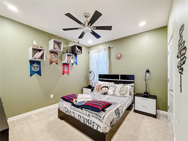 carpeted bedroom with ceiling fan