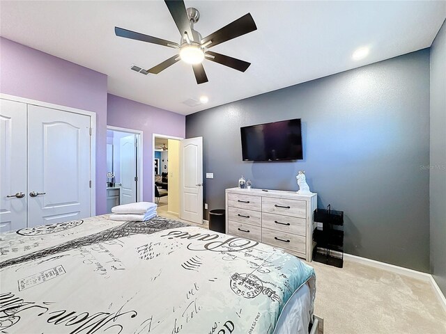 bedroom featuring light carpet, a closet, and ceiling fan