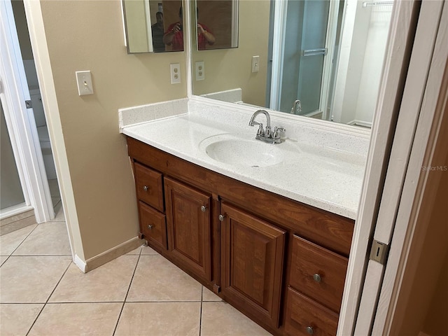 bathroom with tile patterned flooring and vanity