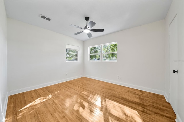 spare room with ceiling fan and hardwood / wood-style floors