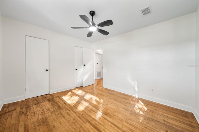 unfurnished bedroom featuring ceiling fan and light wood-type flooring