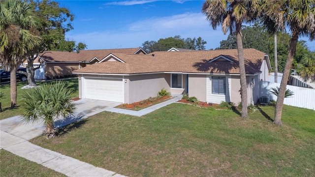 single story home with a front yard, central AC, and a garage