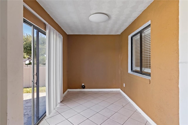 spare room with light tile patterned floors