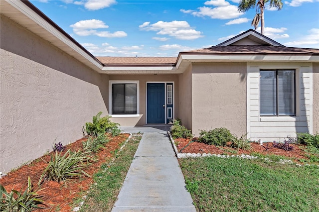 entrance to property with a yard