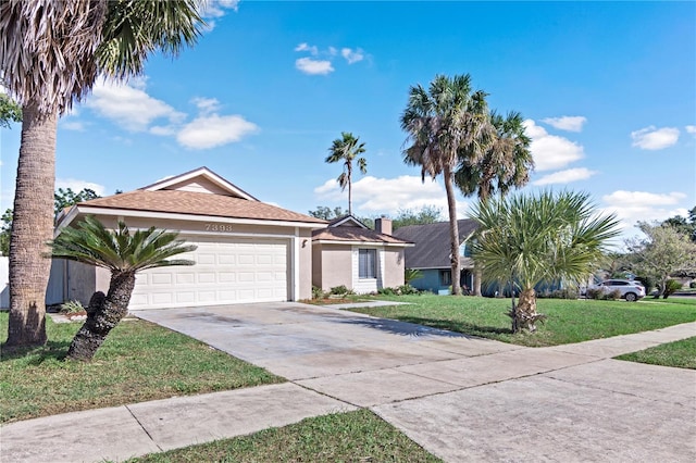 single story home featuring a garage and a front lawn