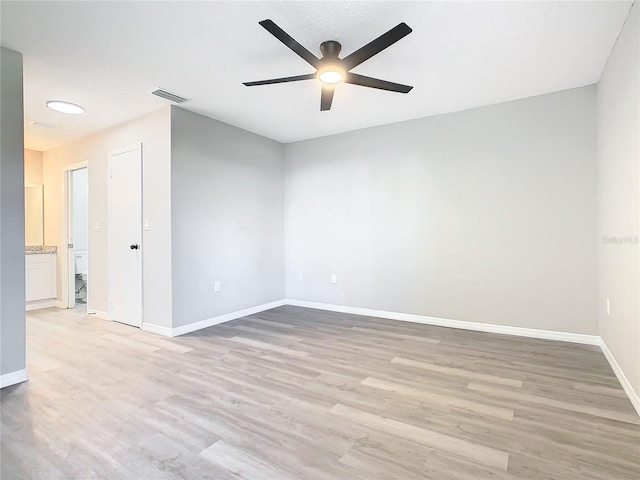 unfurnished room with ceiling fan and light hardwood / wood-style floors