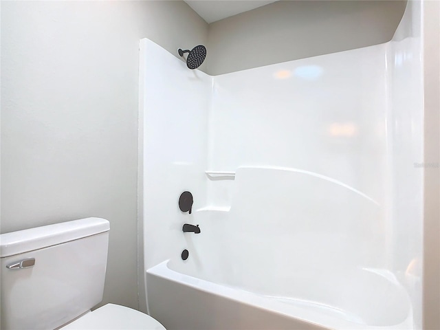 bathroom with shower / bathtub combination and toilet