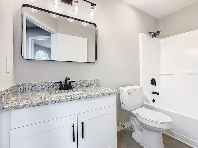 full bathroom with toilet, vanity, tub / shower combination, and hardwood / wood-style flooring