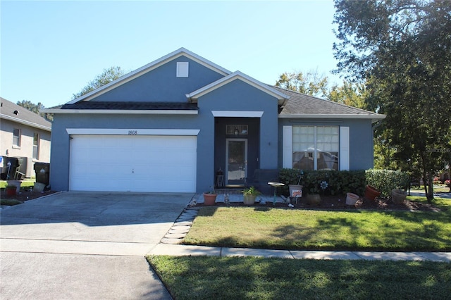 ranch-style house featuring a garage and a front lawn