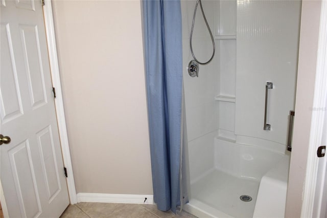 bathroom featuring tile patterned flooring and a shower with shower curtain