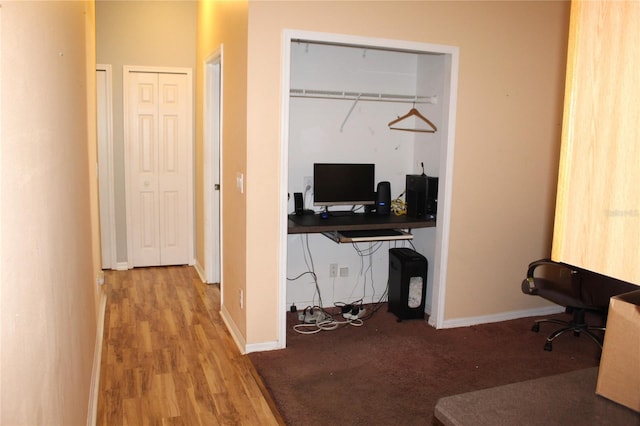 office space with wood-type flooring