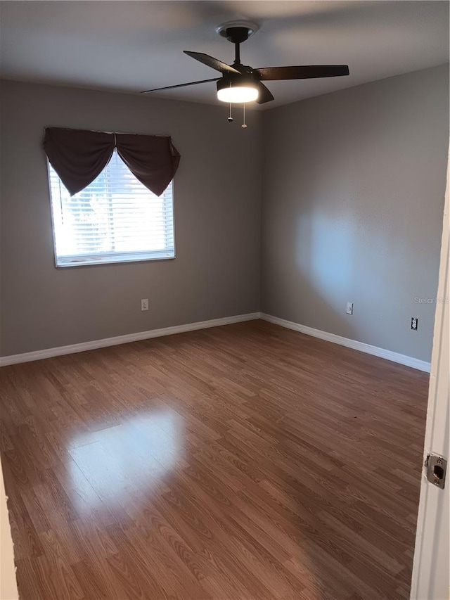 2860 N Powers Dr Unit 8, Orlando, FL 32818 - empty room featuring ceiling fan and wood finished floors