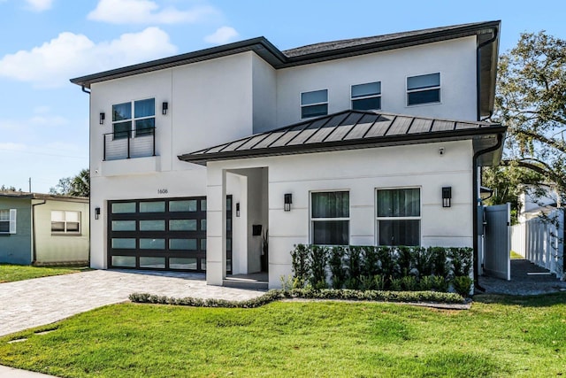 modern home with a garage and a front lawn