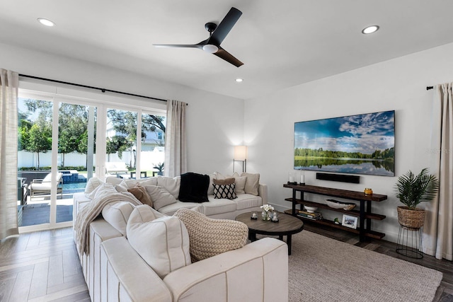 living room with ceiling fan and hardwood / wood-style floors