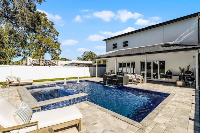 view of pool with pool water feature, a patio area, an outdoor hangout area, and an in ground hot tub