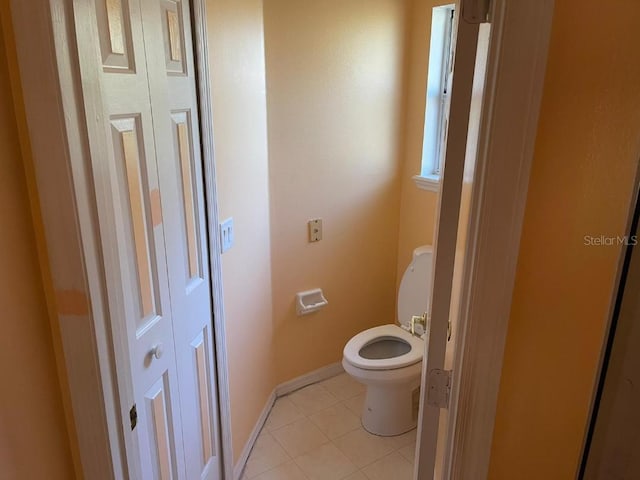 bathroom with tile patterned floors and toilet