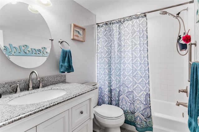 full bathroom featuring vanity, shower / tub combo, and toilet