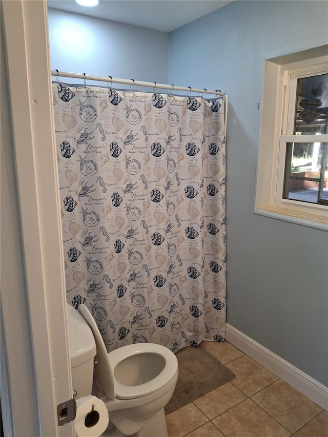 bathroom with tile patterned flooring and toilet