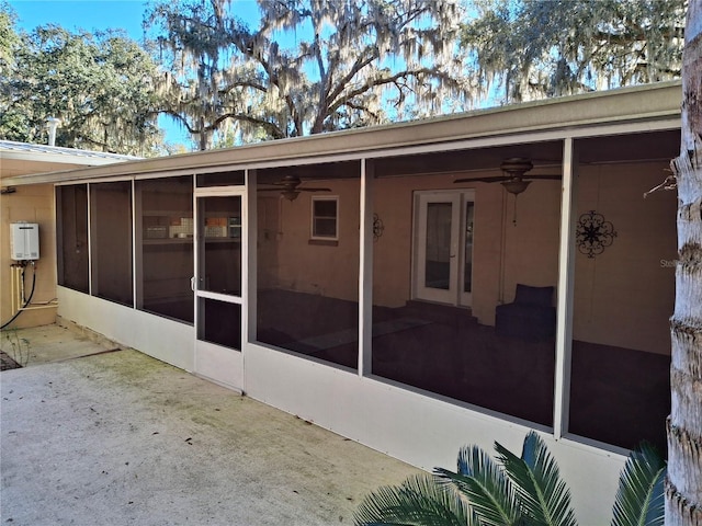 back of house featuring a sunroom