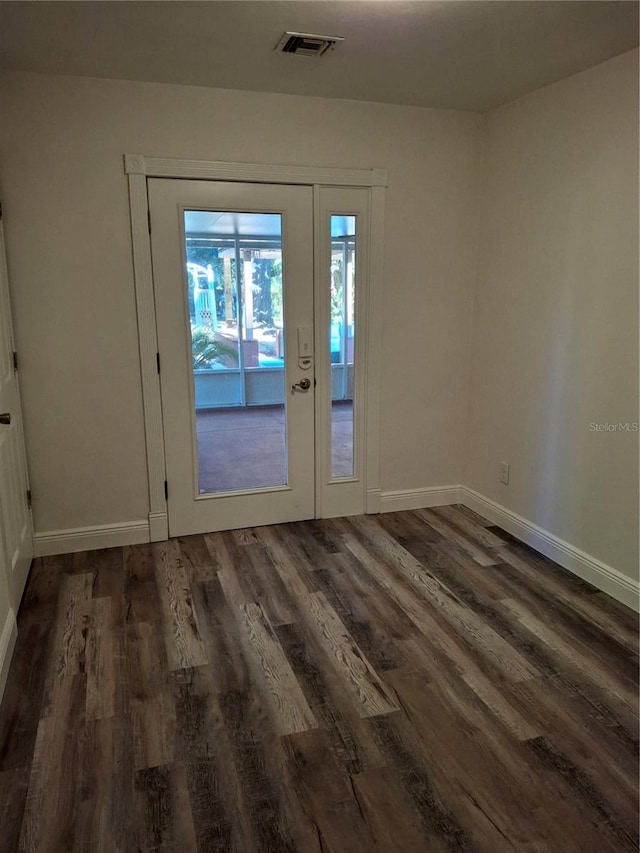 entryway with dark hardwood / wood-style floors