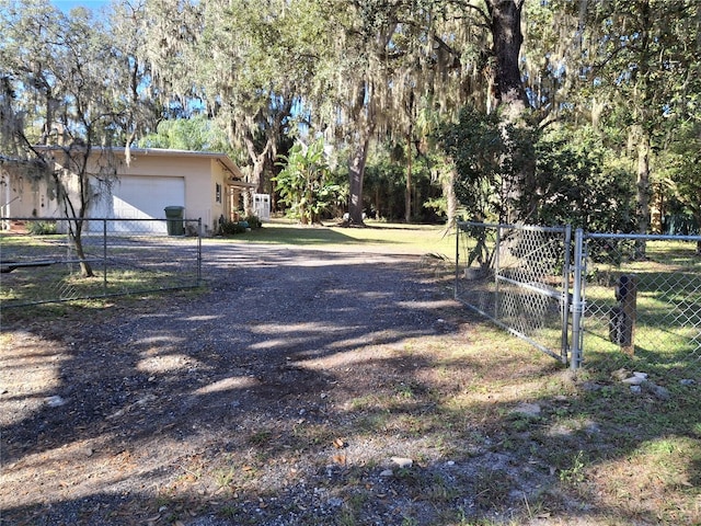 view of yard with a garage