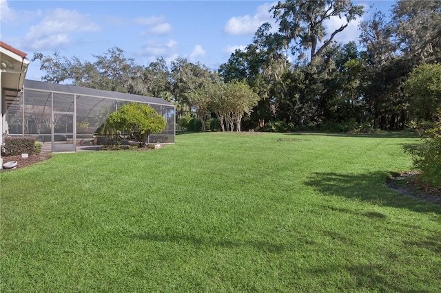 view of yard featuring a lanai