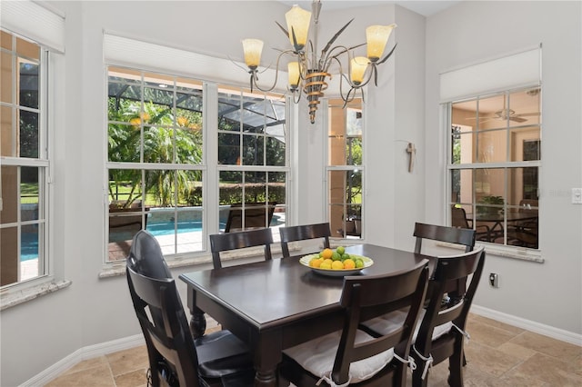 dining area with a wealth of natural light and a notable chandelier