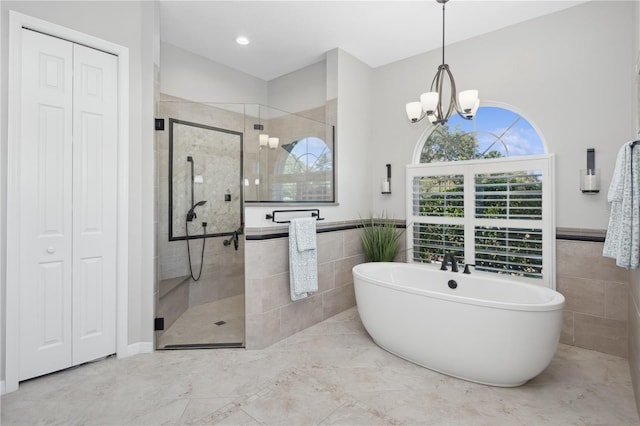 bathroom featuring independent shower and bath