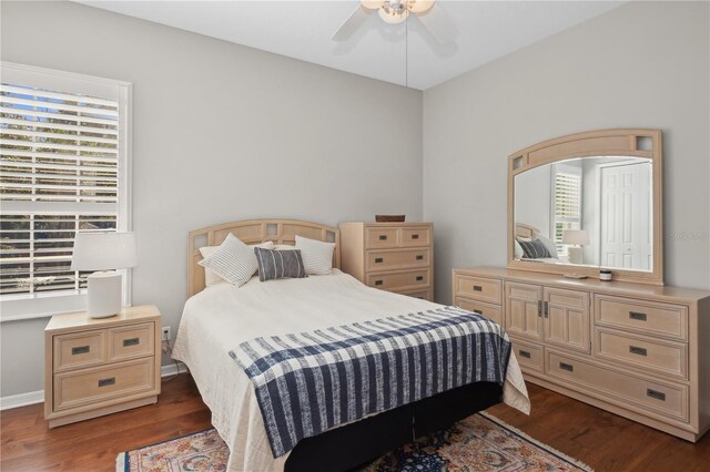 bedroom featuring dark wood-type flooring and ceiling fan