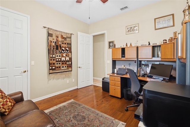 office area with dark hardwood / wood-style floors and ceiling fan