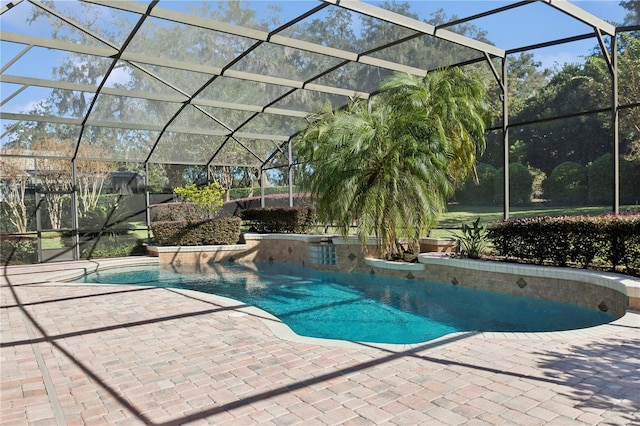 view of swimming pool with a patio and glass enclosure