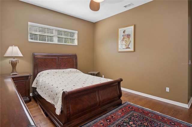 bedroom with wood-type flooring and ceiling fan