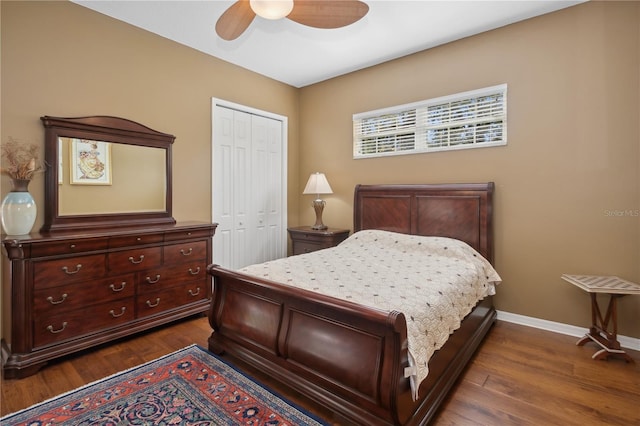 bedroom with dark hardwood / wood-style floors, ceiling fan, and a closet