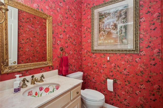 bathroom with vanity and toilet