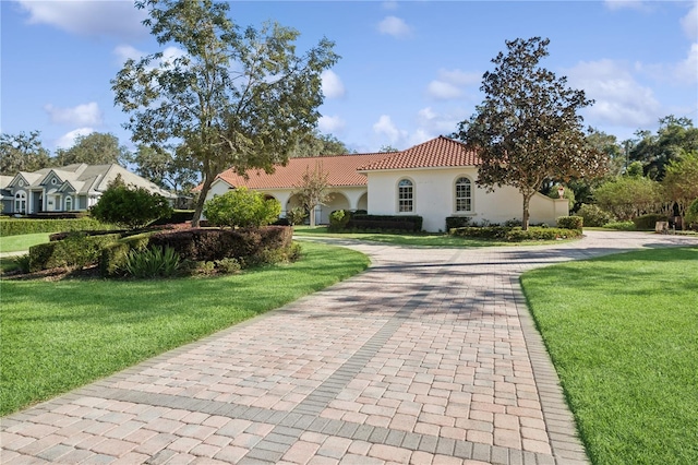 view of front of home with a front lawn