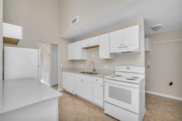 kitchen featuring white cabinetry, white appliances, sink, and light tile patterned floors