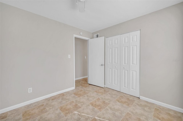 unfurnished bedroom with a closet and ceiling fan