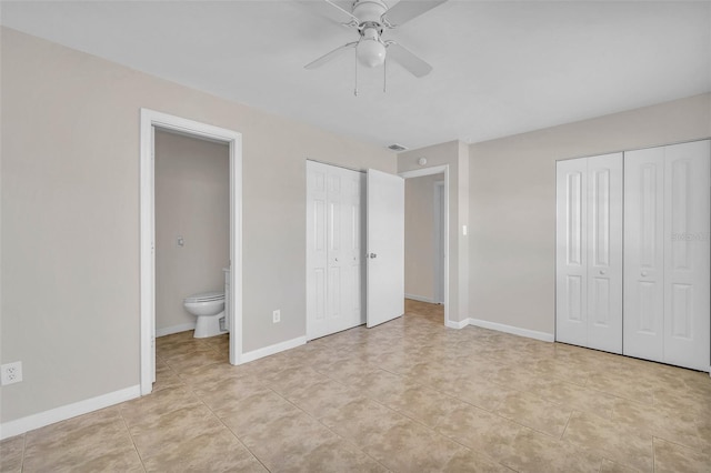 unfurnished bedroom with connected bathroom, two closets, ceiling fan, and light tile patterned flooring