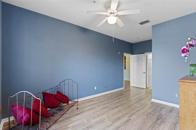 7135 Yacht Basin Ave Unit 237, Orlando, FL 32835 - sitting room featuring wood finished floors, ceiling fan, and baseboards