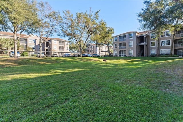 view of community featuring a lawn