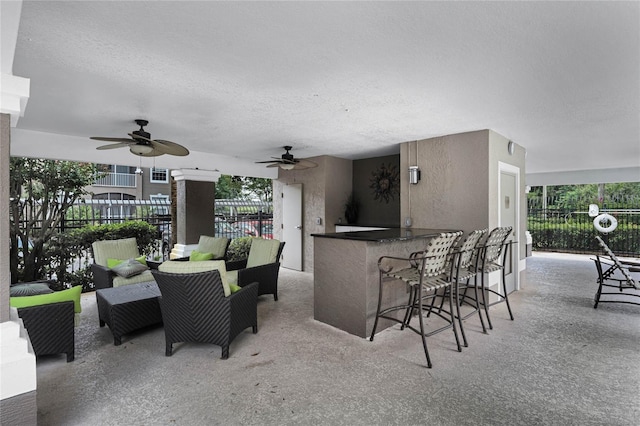 7135 Yacht Basin Ave Unit 237, Orlando, FL 32835 - view of patio / terrace featuring ceiling fan and an outdoor living space