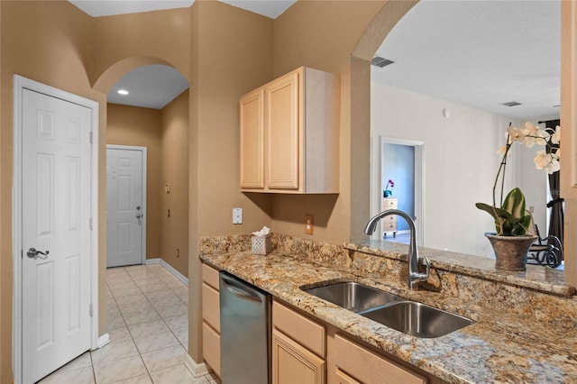 7135 Yacht Basin Ave Unit 237, Orlando, FL 32835 - kitchen with a sink, arched walkways, light stone counters, and light brown cabinetry